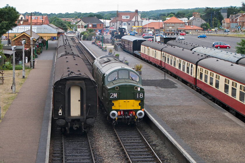 19. D6732, running round, Sheringham station 
 With various matters attended to the crew apply the power to D6732 and take it away from Sheringham light engine to Weybourne. Apart from it now being a light engine the headcode has been correctly set to a Class 2, 'ordinary passenger, branch passenger ' service with an M route identifier that would have probably have been a Norwich service...local advice, please? 
 Keywords: Type 3 Class 37 37032 D6732 light engine Sheringham