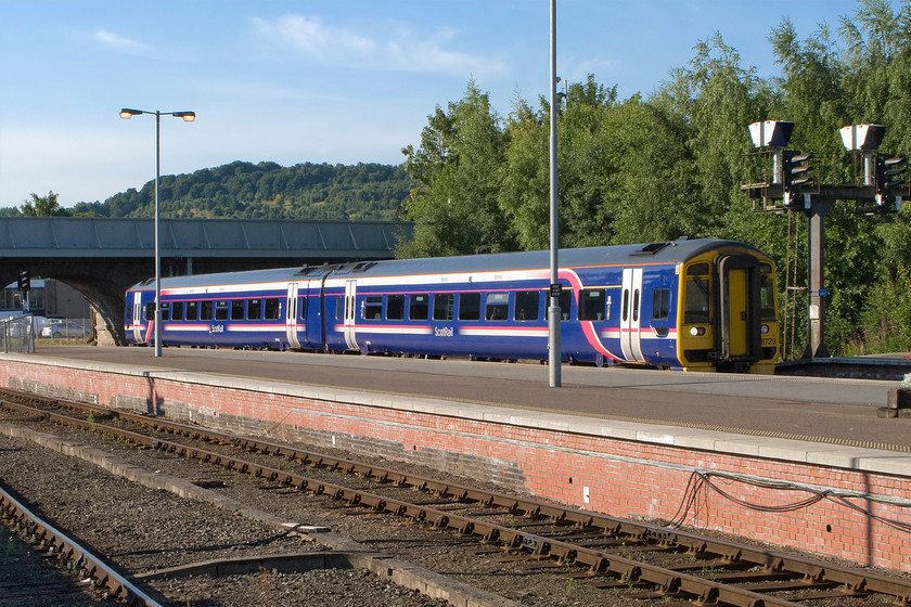 158723, SR 07.34 Edinburgh Waverley-Perth (1L03), Perth station 
 158723 arrives at Perth station with the terminating 1L03 07.34 from Edinburgh Waverley. In contrast to our experience at Dundee earlier in the morning when Andy was declined access to the platform by the gateline staff, at Perth things could not be more different! Staff were interested in what we were doing and most accomodating. 
 Keywords: 158723 07.34 Edinburgh Waverley-Perth 1L03 Perth station ScotRail Express Sprinter