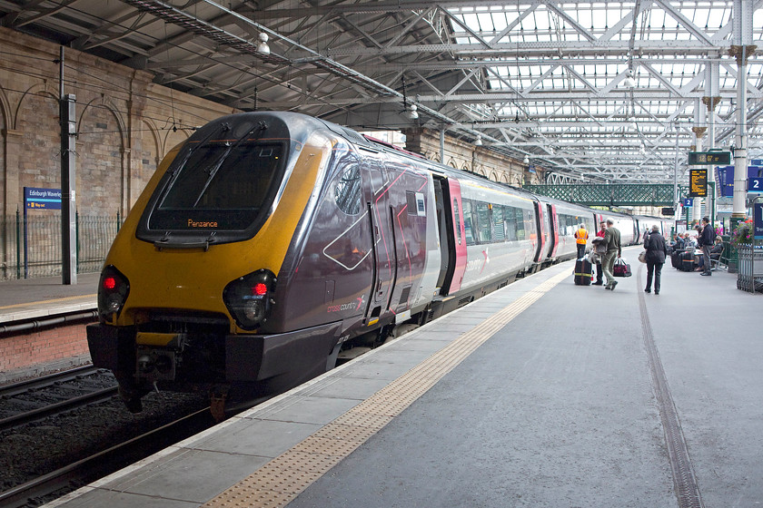 221129, XC 11.00 Glasgow Central-Penzance (1V62), Edinburgh Waverley station 
 Passengers board CrossCoutry's 221129 as it prepares to continue its journey as the 1V62 11.00 Glasgow central to Penzance. This gargantuan 621mile journey takes a roundabout route leaving Glasgow and going east before then heading sort of south and then west to Penzance. Pity any poor soul who would be making this journey in its entirety on an awful Voyager! 
 Keywords: 221129 11.00 Glasgow Central-Penzance 1V62 Edinburgh Waverley station