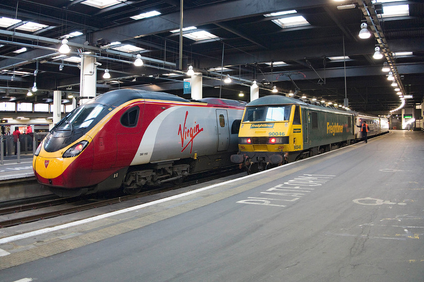 390118, VT 08.07 London Euston-Liverpool Lime Street (1F12) & 90046, CS 23.40 Glasgow Central, Edinburgh-London Euston sleeper (1M11), London Euston 
 390118 waits at platform two of Euston to work the 08.07 to Liverpool Lime Street. Next to in on platform one Freightliner branded 90046 has brought the 'lowland' sleeper in from Glasgow and Edinburgh. This split service comes together (if all goes well!) at the remote Carstairs station. 
 Keywords: 390118 08.07 London Euston-Liverpool Lime Street 1F12 90046 23.40 Glasgow Central Edinburgh-London Euston sleeper 1M11 London Euston