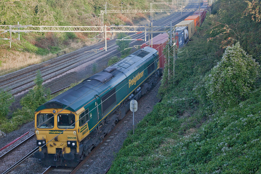 66538, 03.25 Garston-London Gateway (4L52), Victoria bridge 
 66538 leads the 03.25 Garston to London Gateway past Victoria bridge located between Roade and Ashton. A troublesome picture caused by the train being in some early morning deep shade that needed a bit of tinkering. 
 Keywords: 66538 03.25 Garston-London Gateway 4L52 Victoria bridge