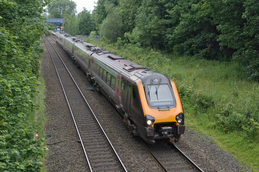 221133, XC 05.11 Manchester Piccadilly-Bournemouth (10O4, 5L), King's Sutton SP494358 
 With King's Sutton station seen in the background largely obscured by rampant and uncontrolled tree growth 221133 passes south working the 05.11 Manchester to Bournemouth CrossCountry service. It is locations such as this on the approach to stations and speed restrictions with vast numbers of trees overhanging the line that Network Rail really needs to pay attention to avoid problems in the autumn leaf-fall months. 
 Keywords: 221133 05.11 Manchester Piccadilly-Bournemouth 10O4 King's Sutton SP494358 CrossCountry Voyager