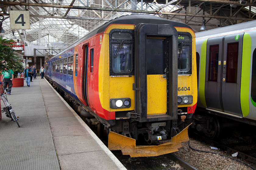 156404, EM 15.07 Crewe-Derby (1K18), Crewe station 
 EMT's 156404 sist in Crewe's platform four waiting to leave with the 15.07 to Derby. I took this train as far as Stoke-on-Trent as the first part of my journey home. Note, Bertie the Brompton bike in the left of the image. 
 Keywords: 156404 15.07 Crewe-Derby 1K18 Crewe station