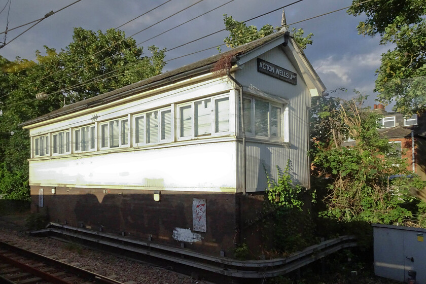 Acton Wells Junction signal box (NL, c1882) 
 This is a signal box that I have been trying to photograph since 1979! Acton Wells Junction is impossible to access lineside buried as it is on the suburban expanses of west London. The nearest that I got to it was in November 1979, see...https://www.ontheupfast.com/p/21936chg/27444279404/acton-well-junction-signal-box-signals but an opportunity from the passing Westbury Wizzo charter means that it is in the bag. The box is a North London structure dating from approximately 1882 but has been considerably modified with UPVC cladding and windows. It no longer controls any semaphores having a workstation installed in 2012. 
 Keywords: Acton Wells Junction signal box North London