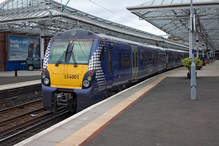 334001 & 334036, SR 13.56 Helensburgh Central-Edinburgh Waverley (2H40, 1L), Helensburgh Central station 
 334001 and 334036 waits to leave the delightful station at Helensburgh Central with the 13.56 to Edinburgh Waverley. Andy and I took this train as far as Dalreoch station. For such new units, I was not impressed with their ride. It may have been the track but the ride was a bit jolty to say the least something akin to a Pacer of all things! 
 Keywords: 334001 334036 2H40 Helensburgh Central station