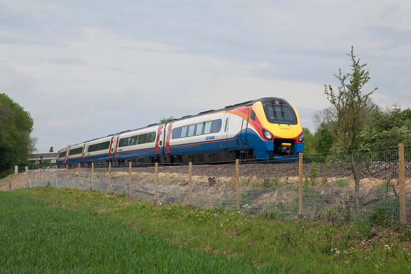 222010, EM 09.40 Sheffield-London St. Pancras (1C32, 7L), Sharnbrook SP988607 
 With the sun trying to break through 222010 races down the gradient from Sharnbrook Summit with the 09.40 Sheffield to St. Pancras. It is passing a spot that has seen a lot of recent work including new fencing but, thankfully not of the palisade type! It's a shame that this spot, and many others on this lien, will soon be spoilt with the arrival of the electrification masts.