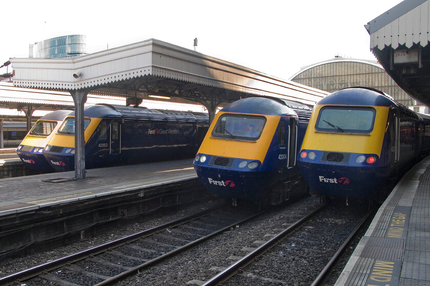 43002, GW 13.05 Paddington-Penzance, 43183, GW unidentified working, 43004, GW 13.00 Paddington-Bristol Temple Meads & 43030, 13.45 Paddington-Swansea, London Paddington station 
 A fine line-up at the country end of London Paddington sees four FGW HSTs ready for their next workings westwards. From left to right.....

- 43002 (the oldest power car seen here as one of the pioneer set 253001 entering service in October 1976), 13.05 to Penzance.
- 43183, an unidentified working.
- 43004 'First for the future/First ar gyfer y dyfodol', 13.00 to Bristol Temple Meads.
- 43030, 13.45 to Swansea. 
 Keywords: First for the future First ar gyfer y dyfodol 43002 13.05 Paddington-Penzance 43183 43004 13.00 Paddington-Bristol Temple Meads 43030 13.45 Paddington-Swansea London Paddington station FGW HST First Great Western