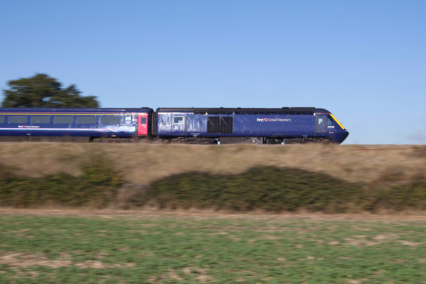 43135, GW 10.58 Bristol Temple Meads-London Paddington (1L48), Knighton SU278890 
 A super broadside shot of 43135 leading the 10.58 Bristol Temple Meads to Paddington service. It is seen speeding eastwards near the village of Uffington in Oxfordshire; something that this power car has done for years! This iconic shape has stood the test of time well as have the Mk. III coaches that remain comfortable and roomy for the passengers. Will their replacements prove to be so competent and enduring? 
 Keywords: 43135 10.58 Bristol Temple Meads-London Paddington 1L48 Knighton SU278890