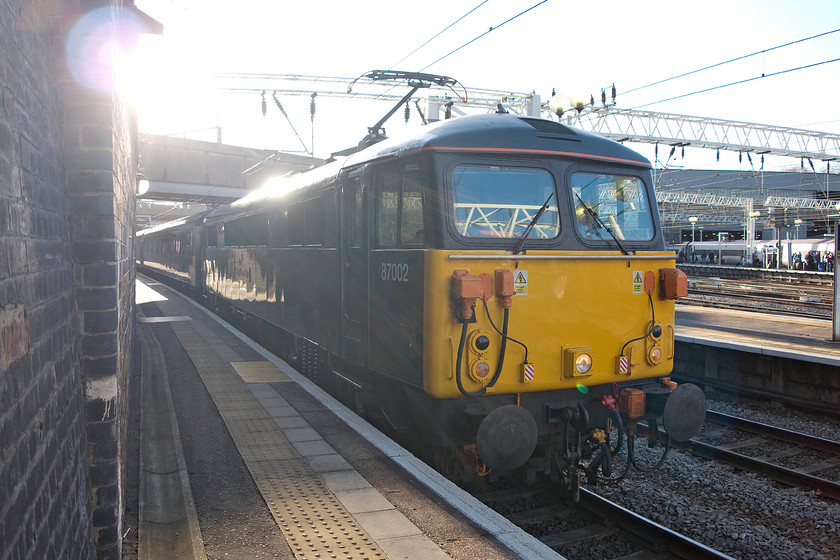 87002, CS 08.27 London Euston-Wembley Sleeper ECS (5M11), London-Euston station 
 87002 'Royal Sovereign' is caught in a difficult position to photograph on Euston's platform one. It is at the head of the Caledonian Sleeper 08.27 Euston to Wembley ECS working. This gets the sleeper stock back to the carriage sidings for servicing prior to the next night's working north again. 
 Keywords: 87002 08.27 London Euston-Wembley Sleeper ECS 5M11 London-Euston station