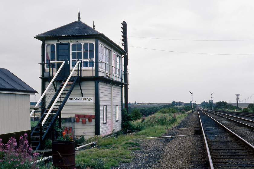 Glendon Sidings signal box (Mid, C.1910) 
 The fine and well-presented box seen here is Gleldon Sidings which has also been known as Glendon East signal box. It was located just a short distance from the point where the Corby route diverged from the MML. The tracks stretching of into the distance lead to Corby and thence onwards to Manton Junction via the famous Harringworth viaduct. As well as controlling the junction it also controlled access to some exchange sidings to the right of this view where Stewarts and Lloyds (towards the end of mining operations that is) mined iron stone. Whilst the box has long gone the line is in somewhat of a renaissance having now been re-doubled after BR singled it and is now electrified seeing a regular service to and from St.Pancras. The following photograph shows the scene in more recent years, see..... https://www.ontheupfast.com/p/21936chg/25598648204/x222010-10-41-corby-londonst-pancras 
 Keywords: Glendon Sidings signal box Midland Railway