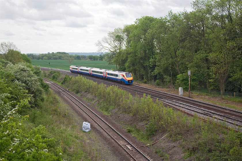 222104, EM 10.01 London St. Pancras-Corby (1M21, 2L), Souldrop Road Bridge SP986609 
 The only way to secure a picture such as this from Souldrop Road Bridge by the use of a ladder. Network Rail have recently re-built this bridge and installed massive parapets. However, they have also undertaken a considerable amount of line-side clearance that has opened up the view. Here, 222104 works the 10.01 St. Pancras to Corby. 221104 was one of the four former Hull Trains units that moved to East Midlands in 2008/09. 
 Keywords: 222104 1M21 Souldrop Road Bridge SP986609