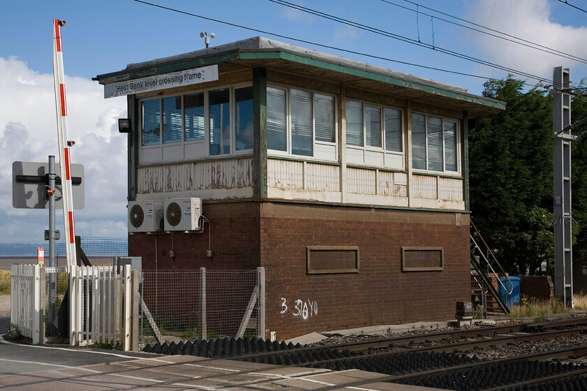 Hest Bank level crossing frame signal box (BR(LMR), 1958) 
 Hest Bank signal box is an interesting and surprising survivor. It is open purely to control the level crossing where the small dead-end road, known locally as The Shore crosses the line. The box was opened in 1958 to London Midland's standard design of the time. I cannot believe that it has a long future ahead of it with automation almost certainly not far away! 
 Keywords: Hest Bank level crossing frame signal box