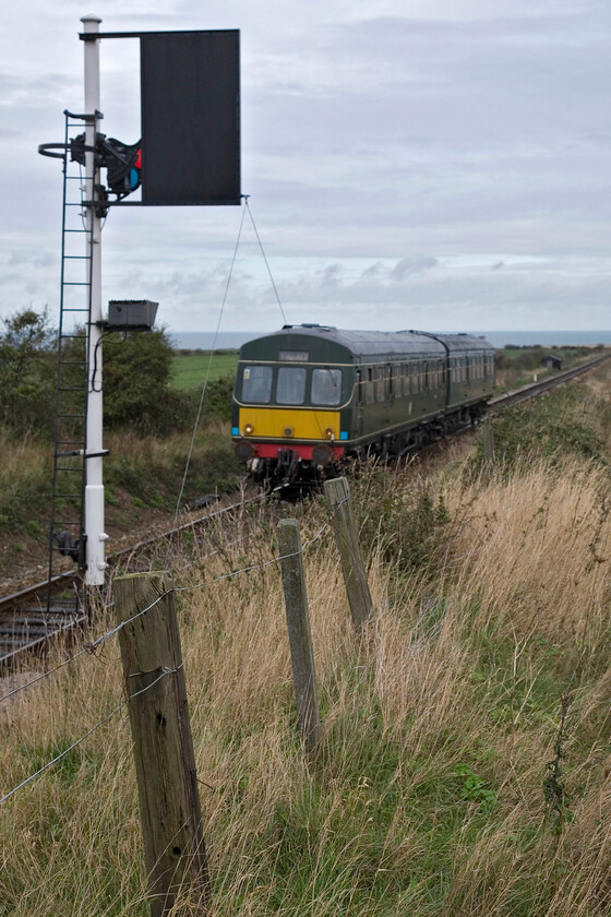 M51192 & M56352, 09.45 Sheringham-Holt, Weybourne TG122424 
 The North Norfolk Railway's first service of the day approaches Weybourne worked by one of the railway's resident Class 101 DMUs. M51192 and M56352 work the 09.45 Sheringham to Holt train about to pass the Weybourne home signal complete with its sighting bard. 
 Keywords: M51192 M56352 09.45 Sheringham-Holt Weybourne TG122424 Class 101 DMU