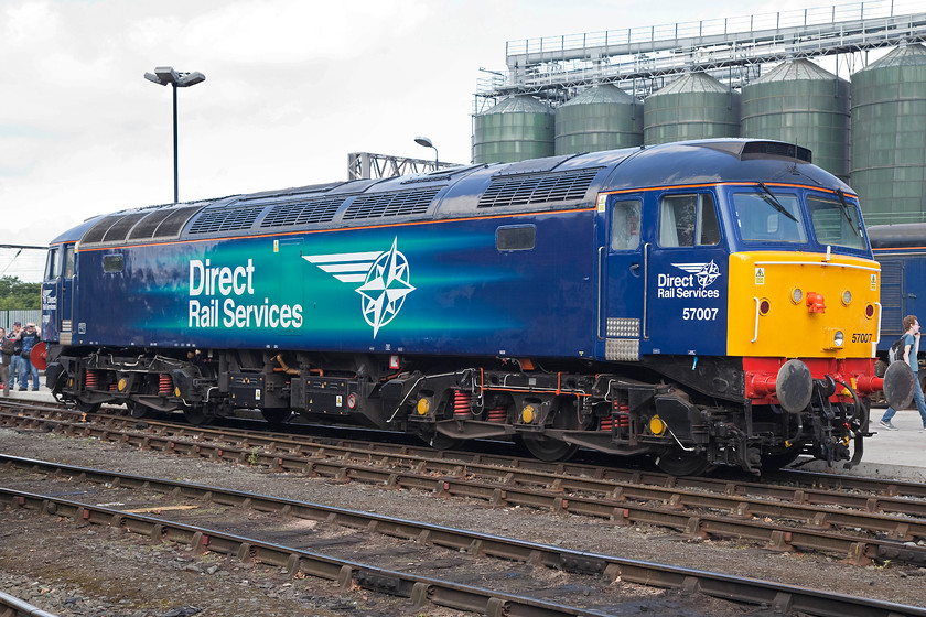 57007, on-display, DRS Gresty Bridge 
 57007 sits on-display at Crewe Gresty Bridge's DRS depot. 57007 was converted by Freightliner in 1999 for use on its trains prior to the squadron arrival of the class 66s. It carried the name ' Freightliner Bond' that was removed in 2008 when its was sold by Freightliner. In its new livery, the former 47332 looks smart and ready for work. 
 Keywords: 57007 DRS Gresty Bridge