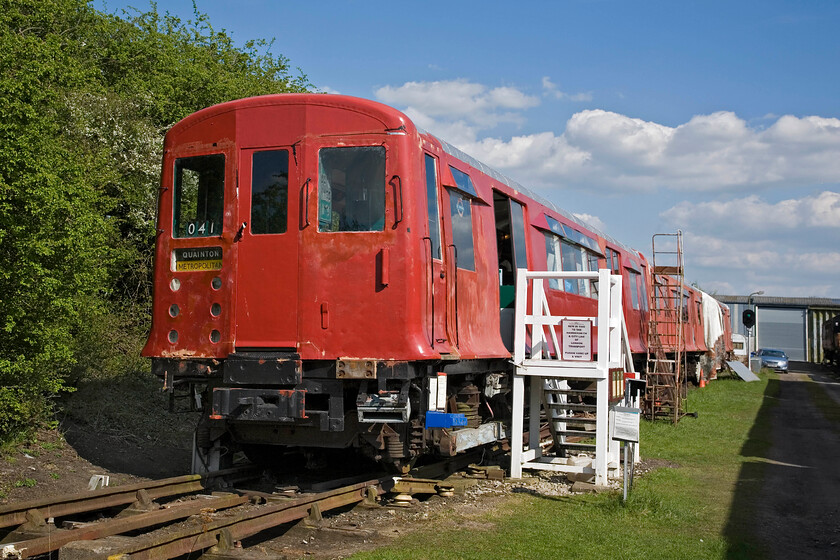 53028, undergoing restoration, Quainton Road Up Yard 
 First used on the Hammersmith and City line this 1938-built O Class 53028 (this view showing the A end) continued in service until 1982 then working on the District line. After brief departmental use at West Ruislip it was bought by the Underground Railway Rolling Stock Trust and arrived at Quainton Road in 1984. When built it operated using an early form of regenerative braking. The Metadyne system was not particularly successful and after many modifications, it was removed with the car then changing its class from O to CO. 
 Keywords: 53028, undergoing restoration, Quainton Road Up Yard