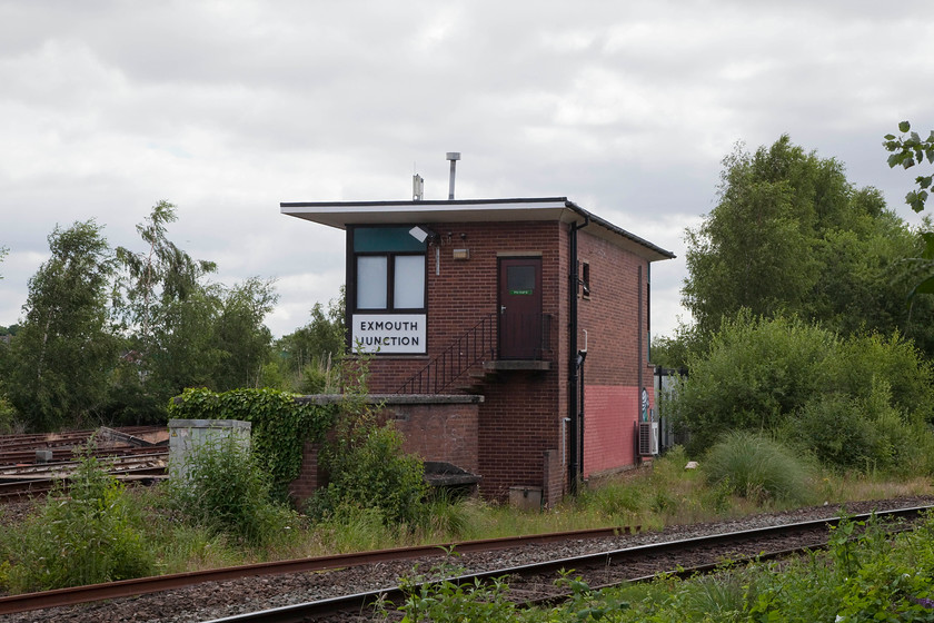 Exmouth Junction signal box (BR, 1959) 
 Built by BR in 1959, Exmouth Junction signal box remains in use with a panel controlling the branch from here to Exmouth. This box replaced a lovely structure just beyond it that was demolished in 1960. Across the running lines in front of the box can be seen the site of the extensive Exmouth Junction shed and sidings. At its height, this was one of the biggest on the Southern Railway. It was also home to the concrete works that manufactured all of the Southern's pre-fabricated structures and fittings 
 Keywords: Exmouth Junction signal box