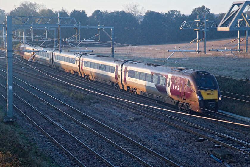 222016, EM 07.02 London St. Pancras-Sheffield (1F10, RT), Harrowden Junction 
 Whilst Harrowden Junction just north of Wellingborough remains a popular spot for railway photography certain angles are compromised considerably by the ingress of the catenary as illustrated here! 222016 works the 07.02 St. Pancras to Sheffield service north past the junction catching some very low autumn sunshine that was bringing a little warmth to a very chilly October morning. 
 Keywords: 222016 07.02 London St. Pancras-Sheffield 1F10 Harrowden Junction