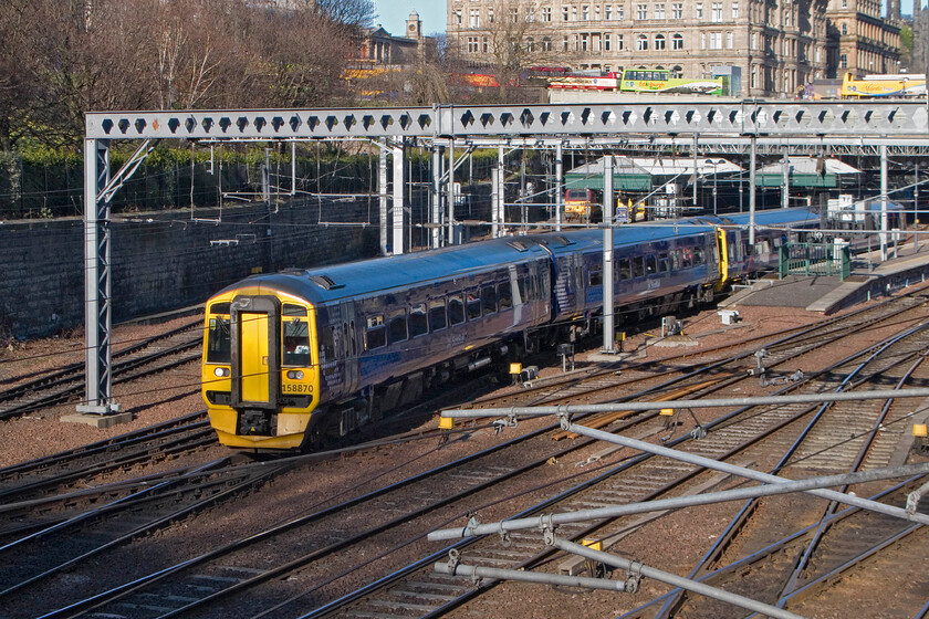 158870, SR 17.03 Edinburgh Waverley-Dunblane, Edinburgh Waverley station from The Mound 
 Taken from The Mound just west of Edinburgh Waverley station 158870 departs working the 17.03 service to Dunblane with another unit on the rear. The unit will have been strengthened in an effort to combat overcrowding in and out of Edinburgh at peak times, something that ScotRail is struggling to deal with at the present time. 
 Keywords: 158870 17.03 Edinburgh Waverley-Dunblane Edinburgh Waverley station from The Mound ScotRail