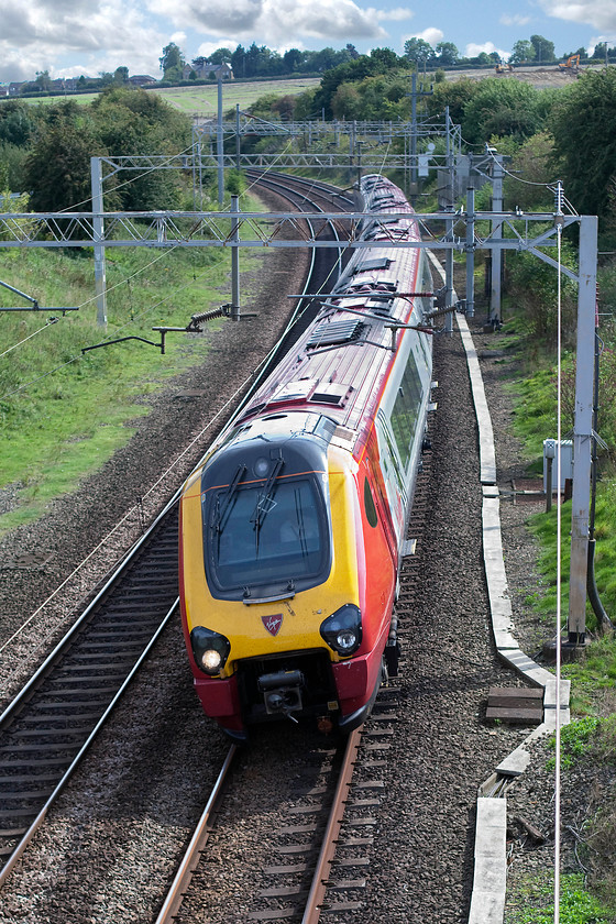 Class 221, VT 14.23 London Euston-Birmingham New Street (9G26, 1L), Dodford Lane Bridge SP623607 
 An unidentified class 221 takes a curve just north of Weedon with the 14.23 Euston to Birmingham New Street. In the background the new Weedon bypass can be seen under construction. The bridge that has been constructed for this new road may well offer a new photographic opportunity? 
 Keywords: Class 221 9G26 Dodford Lane Bridge SP623607