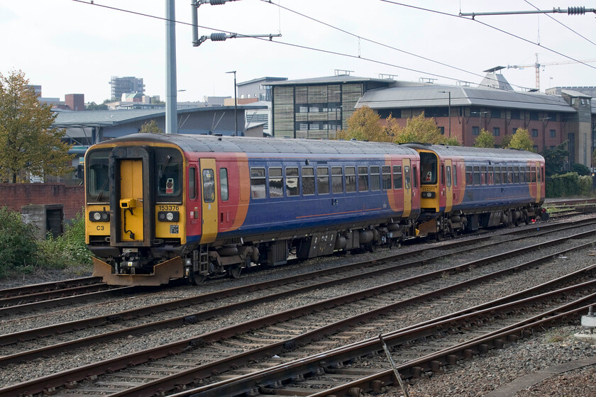 153376 & 153311, stabled, Norwich Yard 
 With the rollout of new stock by various operators underway a number of Class 153 were surplus to requirements. Some moved to other operators to augment their services with Network Rail purchasing three in May 2021. Two of the three that they acquired are seen stabled in Norwich Yard adjacent to the station. 153376 and 153311 still wear their EMR liveries but are now debranded having the addition of various recording equipment. I suspect that Network Rail will get round to painting them in their house yellow paint scheme unless the take over by the fabled GBR changes this? The last time that I saw 153311 was less than a year ago with it heading to Wolverton Works for attention just six months before its change of ownership, see...... https://www.ontheupfast.com/p/21936chg/29876083204/x153311-10-30-etches-park-wolverton 
 Keywords: 153376 153311 stabled Norwich Yard