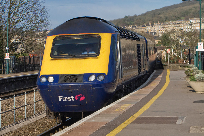 43070, GW 14.30 London Paddington-Bristol Temple Meads (1C18), Bath Spa station 
 With the fine Georgeon properties of Bathwick Hill in the background, the 14.30 Paddington to Bristol 1C18 HST service arrives at Bath Spa. The driver of 43070 'The Corps of Royal Electrical and Mechanical Engineers' has lowered his sun visor to protect himself from the low and strong early spring sunshine 
 Keywords: 43070 14.30 London Paddington-Bristol Temple Meads 1C18 Bath Spa station First Great Western HST The Corps of Royal Electrical and Mechanical Engineers