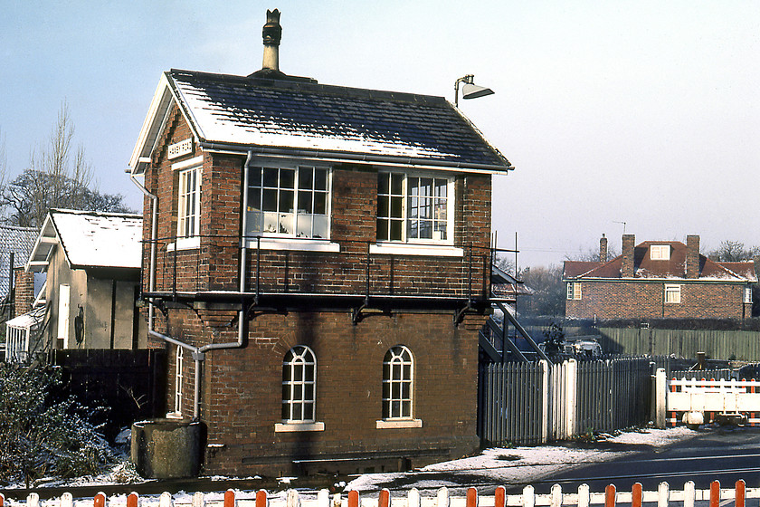 Haxby Road signal box (NER, c.1873) 
 The typical first-generation NER signal box on Haxby Road is seen in the early morning sun. Notice the electrical wheel boom level crossing gates across York Road indicating a train was approaching. Unfortunately, I do not have a note of what the working observed was but I suspect that it was a unit to or from Scarborough. In an act of institutionalised vandalism the box was closed and demolished in 1989 a year after its twin a short distance away at Haxby came by the same fate. 
 Keywords: Haxby Road Signal Box NER North Eastern Railway