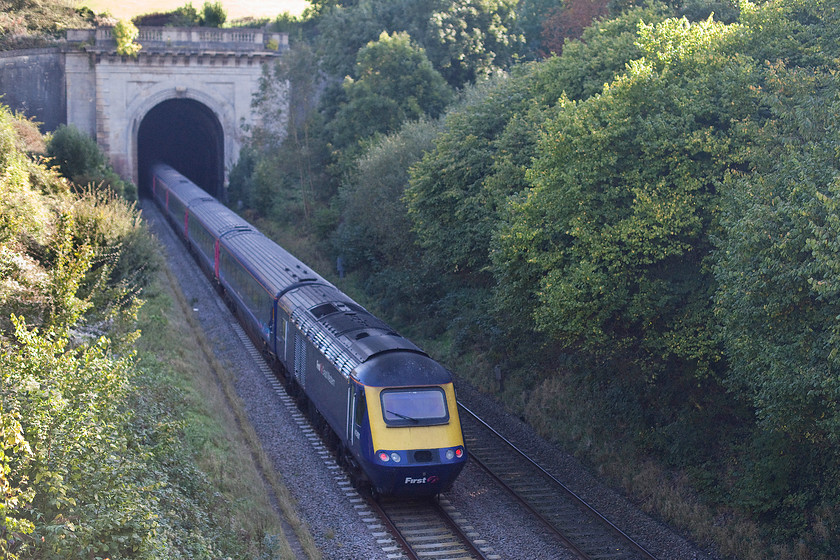 Class 43, GW 11.00 Bristol Temple Meads-London Paddington (1A14), A4 road bridge, Box 
 An unidentified class 43 HST plunges into Box tunnel forming the 11.00 Bristol Temple Meads to Paddington service. Even by midday the sun was not able to illuminate the depths of the cutting here but it is mid-October I suppose! 
 Keywords: Class 43 11.00 Bristol Temple Meads-London Paddington 1A14 A4 road bridge, Box