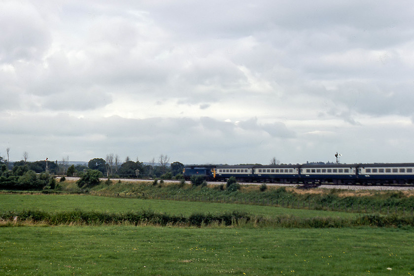 50046, 07.30 London Paddington-Penzance (1B24), Castle Cary 
 Having packed up my camp and secured everything on my bike, 50046 'Ajax' passes Castle Cary with the 1B24 07.30 London Paddington to Penzance working. As can be seen, it was not an inspiring morning with a lot of clouds 
 Keywords: 50046 07.30 London Paddington-Penzance 1B24 Castle Cary