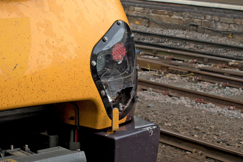 Damaged headlight, 221137, XC 11.47 Southampton-Newcastle (1E44, 8L), Sheffield station 
 On a previous run the headlight of 221137 has sustained considerable damage. There is evidence that it could have been a bird of some kind given the blood and feathers. As the internal lights look to be undamaged, the train would not be declared a failure. However, once the unit returns to a depot with such facilities, it will no doubt be repaired. 
 Keywords: 221137 11.47 Southampton-Newcastle 1E44 Sheffield station