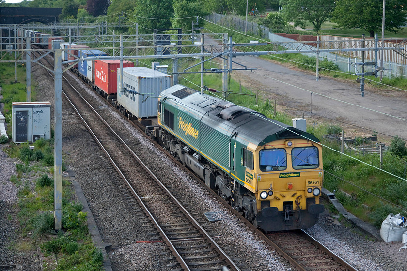 66561, 14.03 Ditton-Felixstowe North (4L92, 6E), site of Roade station 
 Freight number 1 (17.40) -

The 14.03 Ditton to Felixstowe largely unaffected by the shenanigans going on around Long Buckby arriving six minutes early. 
 Keywords: 66561 14.03 Ditton-Felixstowe North 4L92 site of Roade station