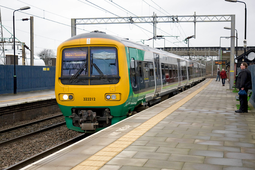 323212, LM 14.01 Walsall-Wolverhampton (2W34), Bescot Stadium station 
 323212 returns to Bescot Stadium station with the 14.01 Walsall to Wolverhampton. I came out from New Street earlier in the afternoon on this unit and I am about to return on it again! Bescot Stadium is a pretty desolate station with very basic facilities just south of Walsall. 
 Keywords: 323212 14.01 Walsall-Wolverhampton 2W34 Bescot Stadium station