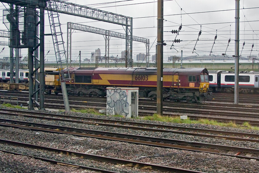 66103, 06.00 Willesden West London Junction-Bescot Yard (6R02, 17E), Wembley Yard 
 The rear of the 06.00 Willesden West London Junction to Bescot engineering train sits stabled in Wembley Yard waiting to depart later in the afternoon. 66103 will tag along for the ride back to Birmingham. Notice that it is still in its as-delivered EWS livery with rather conspicuous DB vinyls rather clumsily stuck over the '3 beastie' images. 
 Keywords: 66103 06.00 Willesden West London Junction-Bescot Yard 6R02 Wembley Yard.jpg