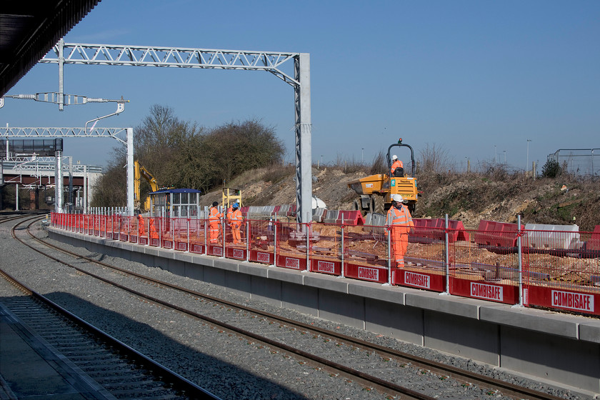 Former platform 5, Wellingborough station 
 Since my last visit to Wellingborough station progress has been made on the rebuilding of the old platform five to be renumbered platform four when it opens. Work commenced just under a year ago when I took a photograph from a virtually identical location, see..... https://www.ontheupfast.com/v/photos/21936chg/26083240604/former-platform-five-wellingborough 
Whilst there is still much work to do, I notice that, rather incongruously, a shelter has been installed amongst all the construction activity! 
 Keywords: Former platform 5 Wellingborough station