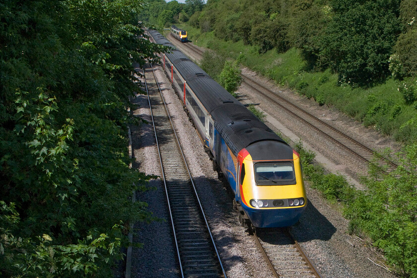 43060, EM 13.32 Nottingham-London St. Pancras (1B48) & 222019, EM 14.16 Corby-London St. Pancras (1P49), Glendon Road bridge SP855815 
 43060 heads south in the afternoon sunshine leading the 13.32 Nottingham to St. Pancras EMT service. In the background, Meridian 222019 has just rejoined the course of the MML curving in from the right at Glendon Junction working the 1P49 14.16 Corby to St. Pancras 'stopper'. 
 Keywords: 43060 13.32 Nottingham-London St. Pancras 1B48 222019 14.16 Corby-London St. Pancras 1P49 Glendon Road bridge SP855815 EMR East Midland Trains HST Meridian