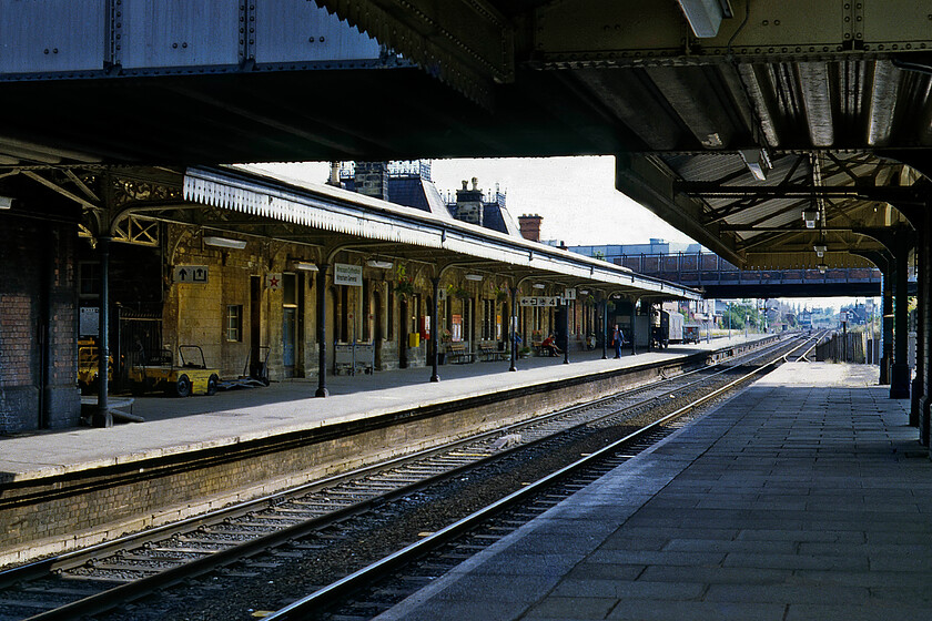 Wrexham General station 
 A view along Wrexham General station looking south reveals its unmistakable GWR heritage. The first station was opened on this site in 1846 with the present-day one opening in 1912. The station has two large and ornate wrought iron ringed towers above the entrance, a design found elsewhere on the GWR network, for example at Truro, see.... https://www.ontheupfast.com/p/21936chg/24717823604/frontage-truro-station.The Grade II listed station has recently undergone a thorough restoration and a very nice station it is now. 
 Keywords: Wrexham General station