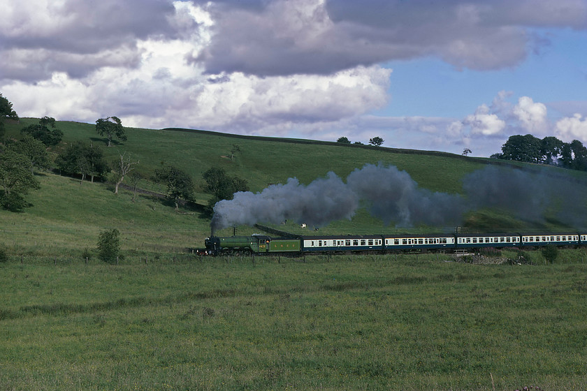 4472, return leg of The North Yorkshireman, Skipton-Carnforth, Giggleswick SD793638 
 The lush and green fields of North Yorkshire do their best to camouflage 4472 'Flying Scotsman' in its apple green livery as it climbs away from Giggleswick in North Yorkshire. It is heading the returning North Yorkshireman railtour from Skipton to Carnforth. 
 Keywords: 4472 The North Yorkshireman Skipton-Carnforth Giggleswick SD793638