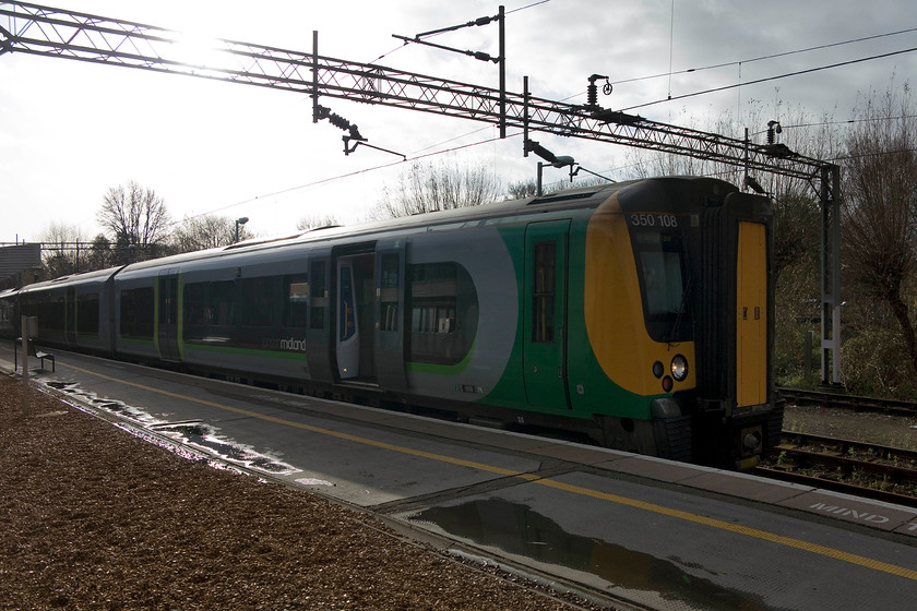 350108, LM 11.49 London Euston-Birmingham New Street (1W11, 1L), Northampton station 
 Our train to Birmingham waits at Northampton station. 350108 forms the 11.49 Euston to Birmingham New Street. Taken directly into the early winter sunshine but as with all my 'train travelled on ' pictures, it acts purely as a record; that's my excuse anyway! 
 Keywords: 350108 11.49 London Euston-Birmingham New Street 1W11 Northampton station