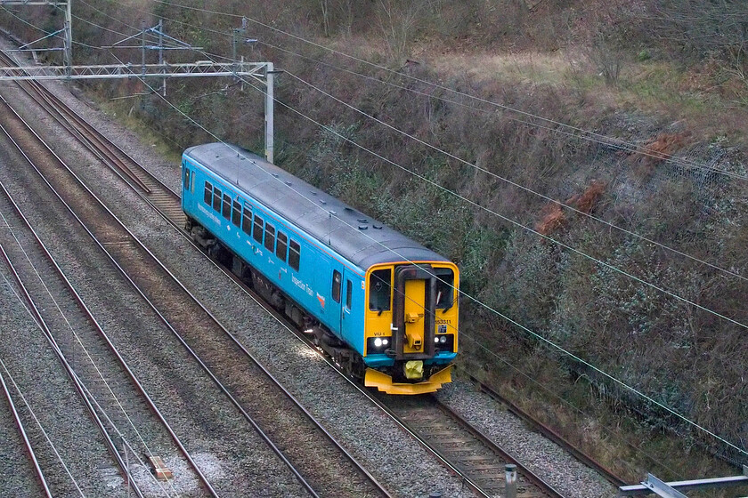 153311, 12.28 Derby RTC-London Euston (2Z30, 8E), Hyde Road bridge 
 With its bright light illuminating the track below, 153311 passes Roade. The video inspection unit was running instead of the more common NMT HST that usually passes this spot on a Tuesday as the 2Z30 12.28 Derby to Euston. Back in 2020, I photographed this same unit passing very close to this location, then still operated by EMT and heading to Wolverton Works for attention, see.... https://www.ontheupfast.com/p/21936chg/29876083204/x153311-10-30-etches-park-wolverton

Well, that's it for 2024. A Happy New Year to all my readers and here's to 2025! 
 Keywords: 153311 12.28 Derby RTC-London Euston 2Z30 Hyde Road bridge Network Rail