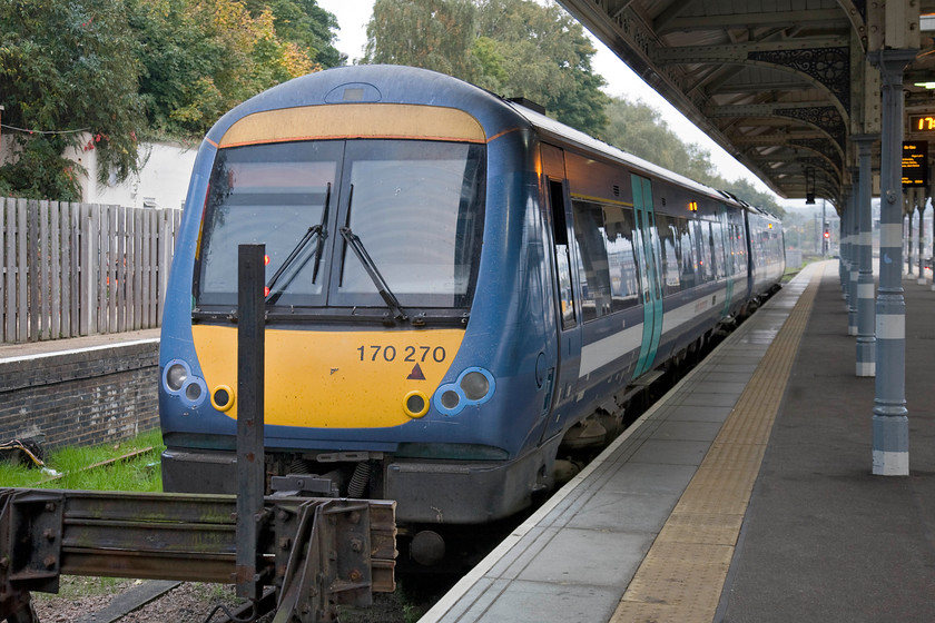 170270, LE 16.45 Norwich-Sheringham (2S26), Norwich station 
 Wearing its old livery 170270 waits at Norwich's platform one. It will soon work the 16.45 service to Sheringham that my wife, son and I would take back to the coastal town. The Class 170s are infinitely better than the more usual Class 156s but they are still only two coaches long and get very overcrowded at times particularly with school children. 
 Keywords: 170270 16.45 Norwich-Sheringham 2S26 Norwich station GA Greater Anglia