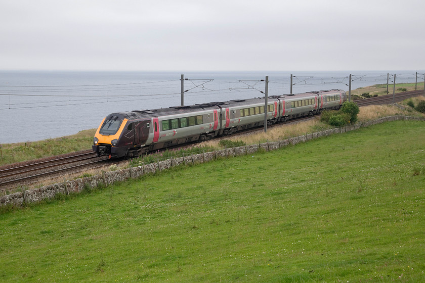 221136, XC 06.25 Plymouth-Glasgow Central (1S39, 9L), Lamberton NT973580 
 221136 passes Lamberton between Berwick and Burnmouth with the bleak North Sea in the background. The CrossCountry Voyager is working the 1S39 06.25 Plymouth to Glasgow Central. Even though this picture is taken less than a mile from the border with England it is still surprisingly far north being on the same latitude as Largs situated on the Firth of Clyde! 
 Keywords: 221136 06.25 Plymouth-Glasgow Central 1S39 Lamberton NT973580