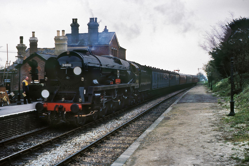 34016, 15.10 New Alresford-Ropley, Ropley station 
 34016 'Bodmin' arrives at Ropley station with the 15.10 service from new Alresford. The Mid-Hants Railway was very much in its infancy at this time with the extension to Alton a pipe dream. Over the intervening forty years, it has emerged as one of the UK's premier heritage lines showing others how to do it! However, I write this during the 2020 COVID-19 pandemic that has had a devastating effect on preserved lines with some unlikely to survive despite some support from the Government. 
 Keywords: 34016 15.10 New Alresford-Ropley Ropley station Watercress Line Mid Hants. Railway Bodmin