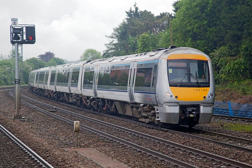 168106, CH 08.14 London Marylebone-Birmingham Snow Hill (1G14, 1L), Princes Risborough station 
 In Chiltern's new and smart livery, 168106 runs non-stop through Princes Risborough station working the 08.14 Marylebone to Birmingham Snow Hill. This 112 mile journey is pretty rapid now when compared to the older units that used to run on this line. The slow speeds and poor patronage actually presented BR with a case to partially close it in the 1980s. Thankfully, Network SouthEast and then Chiltern reversed the rot and the line is now busy and well connected with an even brighter future ahead with the proposed re-opening of the Varsity Line. 
 Keywords: 168106 1G14 Princes Risborough station