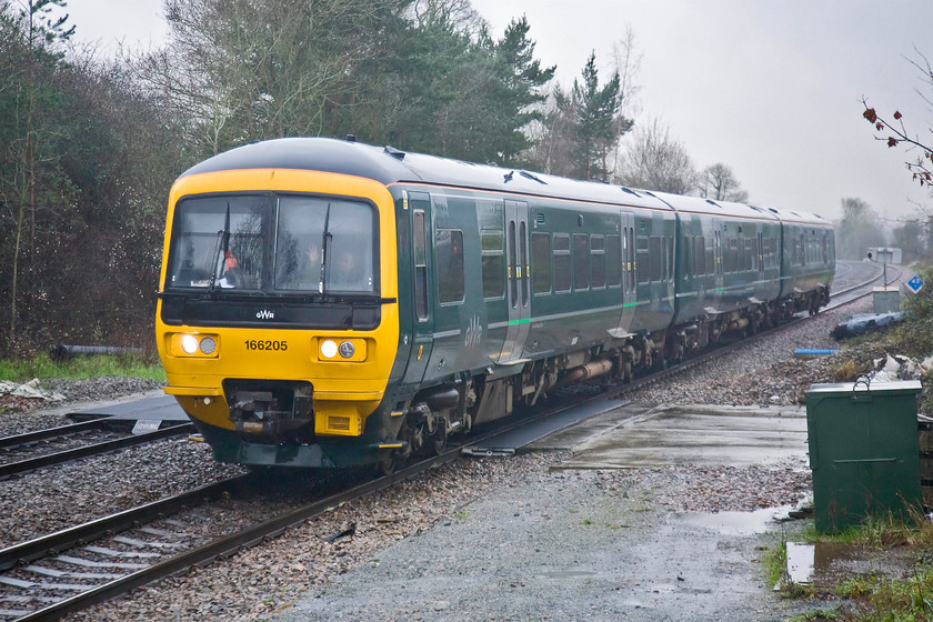 166205, GW 14.37 Basingstoke-Reading (2J40), Mortimer station 
 With a cheery wave from the driver of 166205 as it arrives at Mortimer station. He was probably waving as he felt sorry for us as we had photographed his train in equally poor weather not very long ago at Bramley station, see..... https://www.ontheupfast.com/p/21936chg/29360075404/x165205-gw-14-08-reading-basingstoke He is returning to Reading as the 14.37 ex Basingstoke running as 2J40. 
 Keywords: 166205 GW 14.37 Basingstoke-Reading 2J40 Mortimer station Great Western Railway GWR