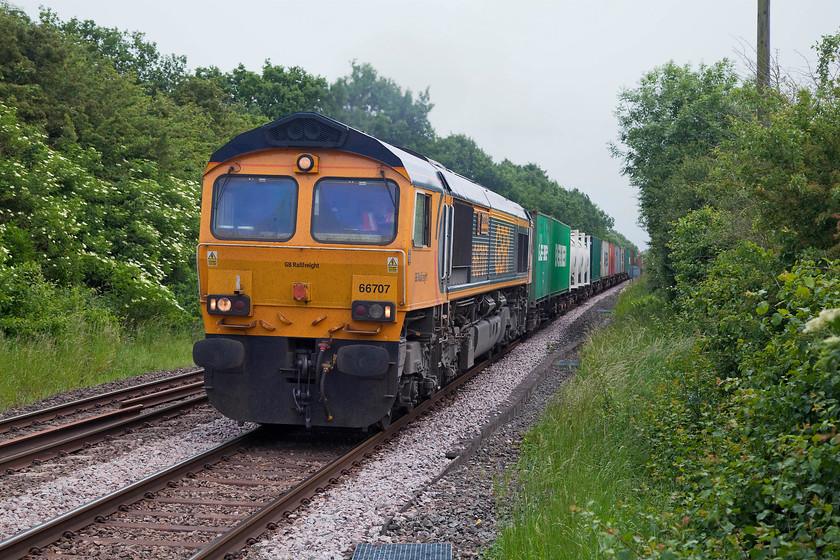 66707, 10.29 Felixstowe North-Birch Coppice (4M29), Egleton SK869070 
 66707 'Sir Sam Fay' hauls the extremely long 10.29 Felixstowe to Birch Coppice Freightliner. It is seen passing Egleton, near to Oakham, from a public Crossing. Sir Sam Fay (1856-1953) was a career railwayman who became the General manager of the Great Central Railway in 1902. This, in attempt to rescue it from a precarious financial position. He very nearly completed this task by introducing a number of initiatives many of which remain today such as season tickets. 
 Keywords: 66707 10.29 Felixstowe North-Birch Coppice 4M29 Egleton SK869070