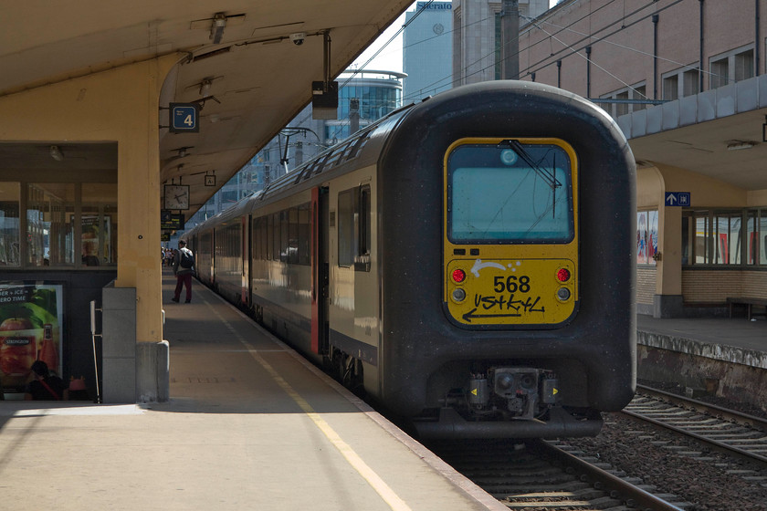 96 568, 16.15 Lokeren-Gent Sint Pieters (IC 2238), Brussels Nord station 
 IC class 96 number 568 waits to leave Brussels Nord station working the 16.15 from Lokeren to Gent Sint Pieters. These IC96s are a familiar site all over Europe in various liveries. The giant rubber end is designed to cushion them when joining and working in multiple. Not the most attractive of designs but they do the job that's asked of them! 
 Keywords: 96 568 16.15 Lokeren-Gent Saint Pieters IC 2238 Brussels Nord station