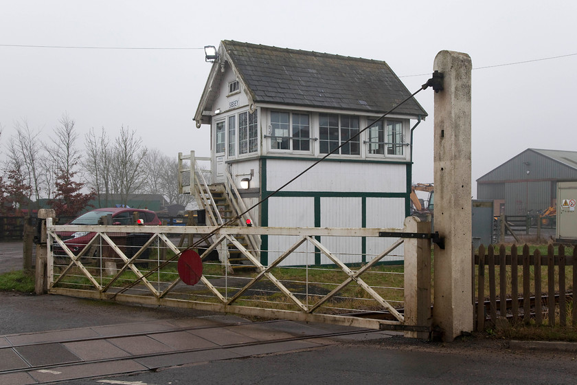 Sibsey Signal Box (GN, 1888) & crossing gates 
 Sibsey signal box is situated just to the east of the village of the same name where the B1184 road crosses the railway. The box has been well maintained and still has its wooden steps but the crossing gates look a little tatty! The box is a type 1 Great Northern box built in 1888 but its future is uncertain as is due to close, along with all the others on the Skegness route, in 2020. 
 Keywords: Sibsey Signal Box GN 1888 crossing gates