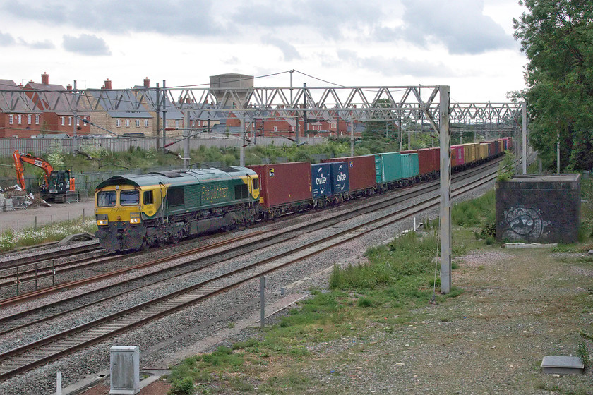 66504, 12.57 London Gateway-Garston (4M57, 34E), site of Roade station 
 Having stopped at the garage to buy bread there was a bit of a COVID related queue and I was conscious that the 12.57 London Gateway to Garston 4M57 was approaching Roade fast. I actually broke into a run as I approached the old station footbridge as it appeared around the corner under Ashton Road bridge. I just had time to get the camera out and set it up to get this photograph of Freightliner's 66504 leading the train. This is a super late afternoon spot when the sun is out but not so good on a dull evening such as this. Compare it with...... https://www.ontheupfast.com/p/21936chg/29012363604/x66425-09-55-tilbury-dirft-4m07-site for example! 
 Keywords: 66504 12.57 London Gateway-Garston 4M57 site of Roade station Freightliner