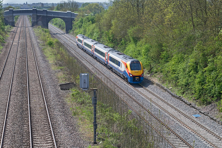 222101, EM 10.29 London St. Pancras-Nottingham (1D24, 9L), Moor End Lane Bridge TL007580 
 A little back-lit but any shot of the pre-electrification MML is worth considering! 222101 works the 10.29 St. Pancras to Nottingham and is seen passing Moor End Lane Bridge on a small lane just north of Radwell in Bedfordshire. Evidence can be seen of works carried out to prepare for electrification with the new raised bridge deck and parapet in the distance. 
 Keywords: 222101 1D24 Moor End Lane Bridge TL007580