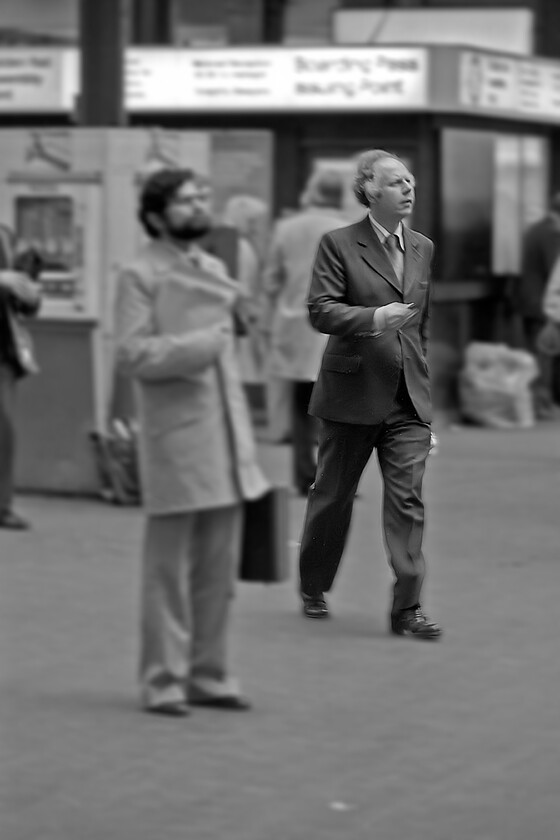 Commuters, London Paddington station 
 Whilst some rush for their train home after a day working in the city others pause and take stock studying the departures' board. I have had to treat this photograph somewhat within Photoshop due to the general lack of proper focus. However, I liked the original image with it telling an everyday story of Paddington station that made it worth the time spent! 
 Keywords: Commuters London Paddington station