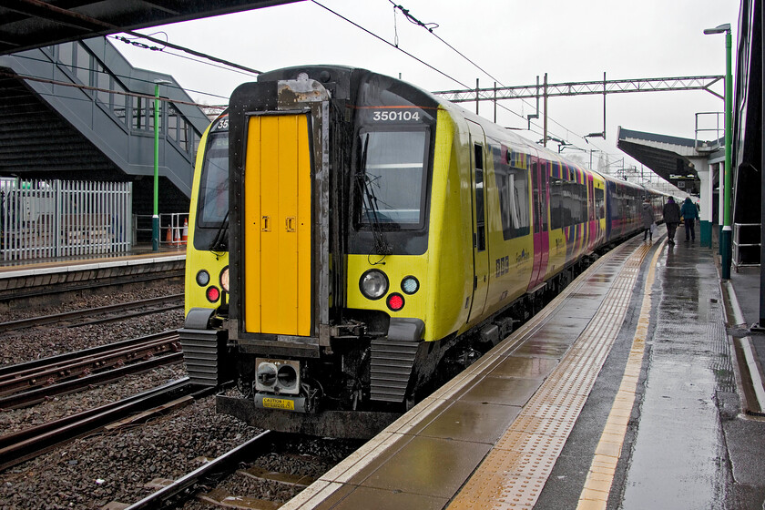 350104, LN 10.06 Birmingham New Street-London Euston (1Y30, 1E), Northampton station 
 Celebrity liveried 350104, to commemorate Liverpool's hosting of Eurovision 2023 in lieu of it being held in war-torn Ukraine, satnds at Northampton working the 10.06 Birmingham to Euston service. My wife and I intended to catch this train but found that it was short-formed and consequently full and standing. We opted to have a coffee and wait for the next service south, a move that worked out for the best; for me at least! 
 Keywords: 350104 10.06 Birmingham New Street-London Euston 1Y30 Northampton station Class 350 Desiro London Northwestern